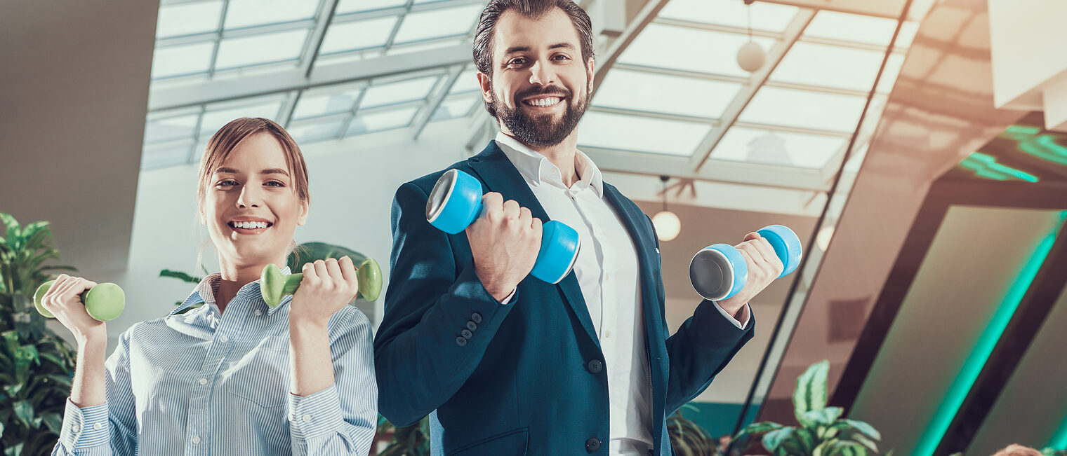 Corporate Lifestyle Healthcare Concept of Business People in Office Interior Working with Dumbbells. Workers Doing Fitness Exercises of Yoga Practice. Wellbeing Employee Man Smiling to Healthy Woman Schlagwort(e): work, fitness, gym, running, workout, yoga, sports, man exercising, exercise, training, office desk, office interior, office building, office people, business, office background, office workers, desk, office work, dumbbell, office, job, sport, occupation, adult, male, health, people, body, businessman, smiling, person, young, working, lifestyle, muscular, professional, fit, positivity, wellbeing, man, arm, manager, corporate, beauty, caucasian, expressing, communication, equipment